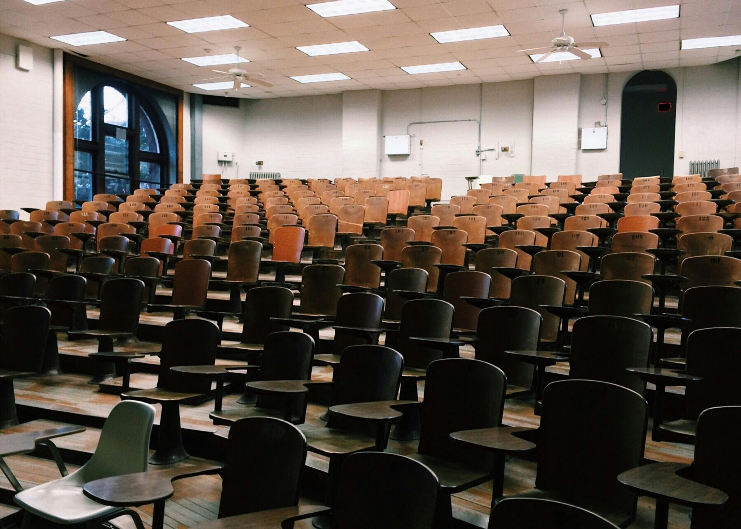 wooden chairs in lecture hall