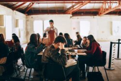 Group of students studying at coffee shop