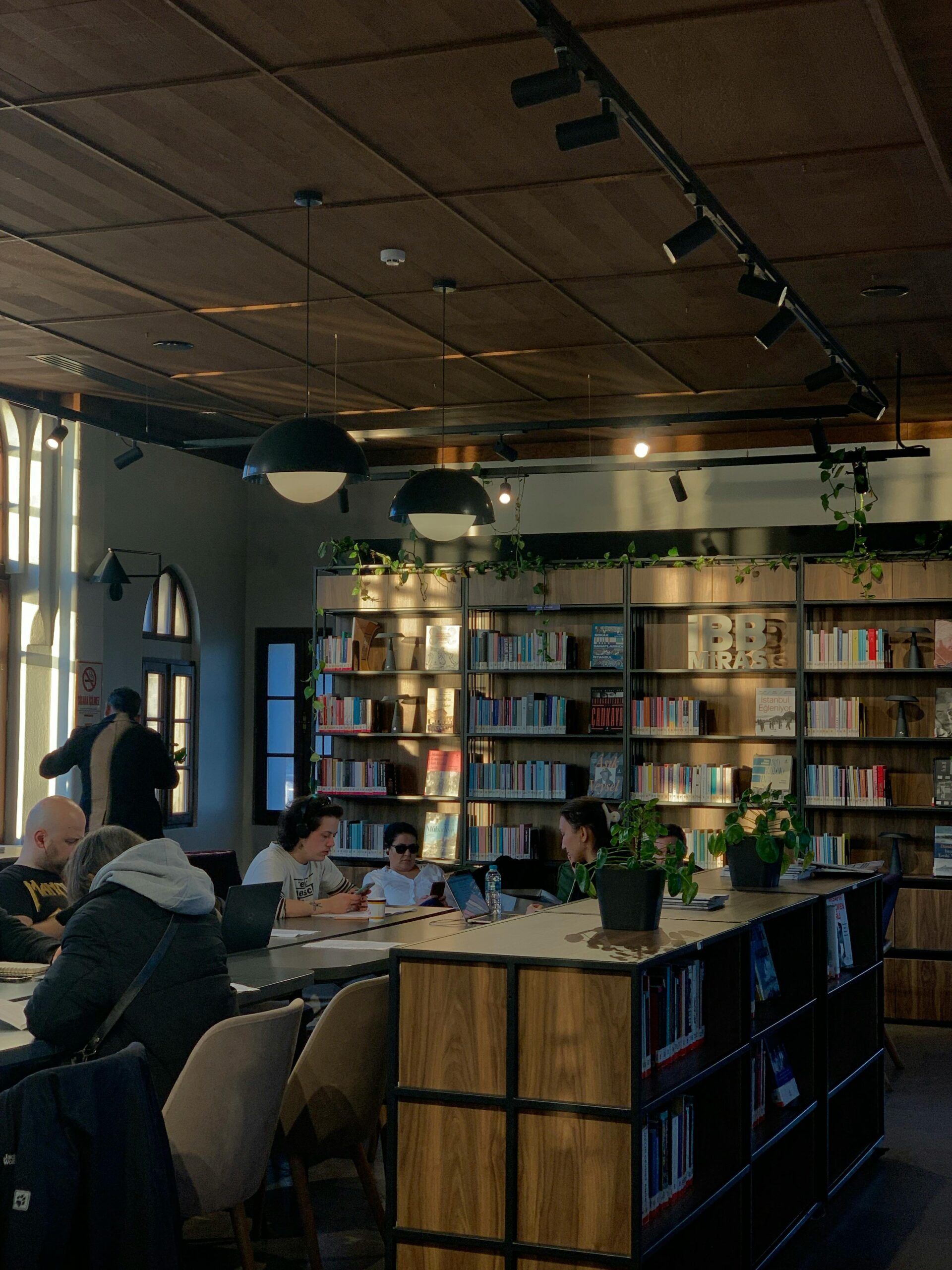 modern library with people studying and reading