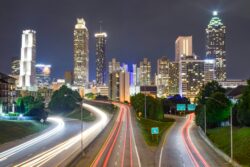Atlanta, Georgia skyline at night with timelapse traffic lights on roads