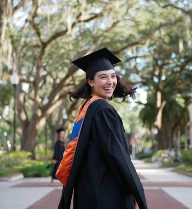 Smiling Woman Wearing Her Graduation Gown