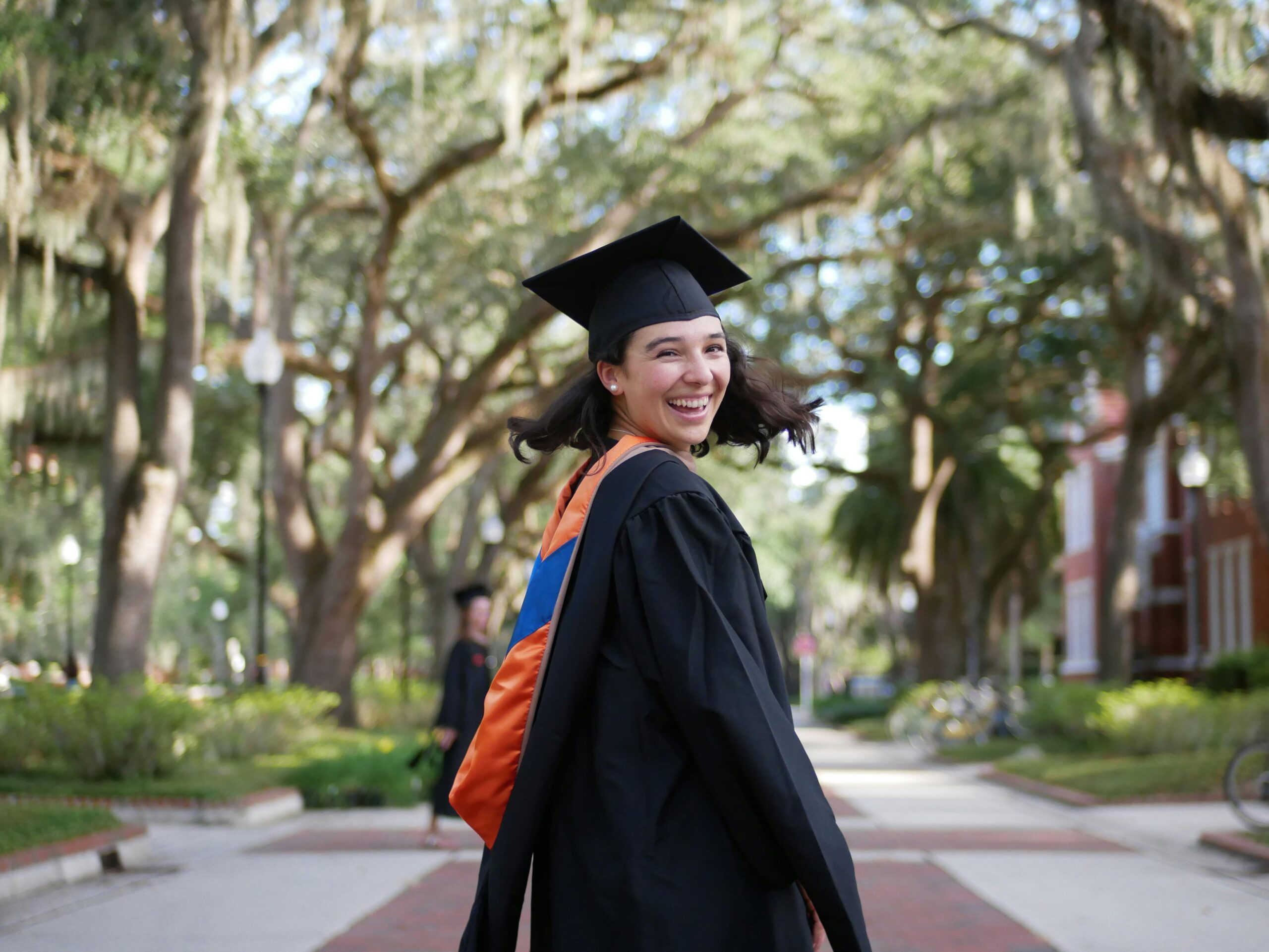 Smiling Woman Wearing Her Graduation Gown