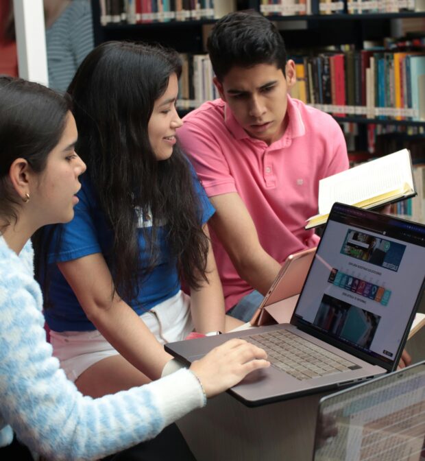 A Group of Students Sitting in a Library and Studying