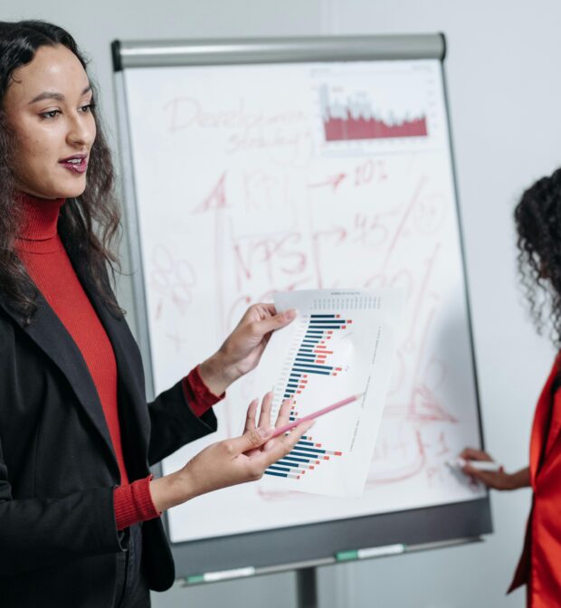 Woman in Black Blazer Discussing