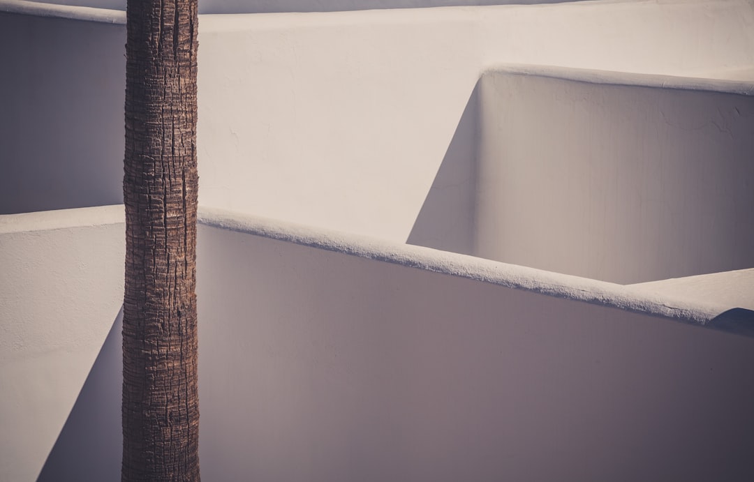 white ceramic bathtub beside brown wicker basket